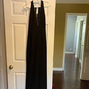 Black  halter style ,strapping back Dress. Slit up the back